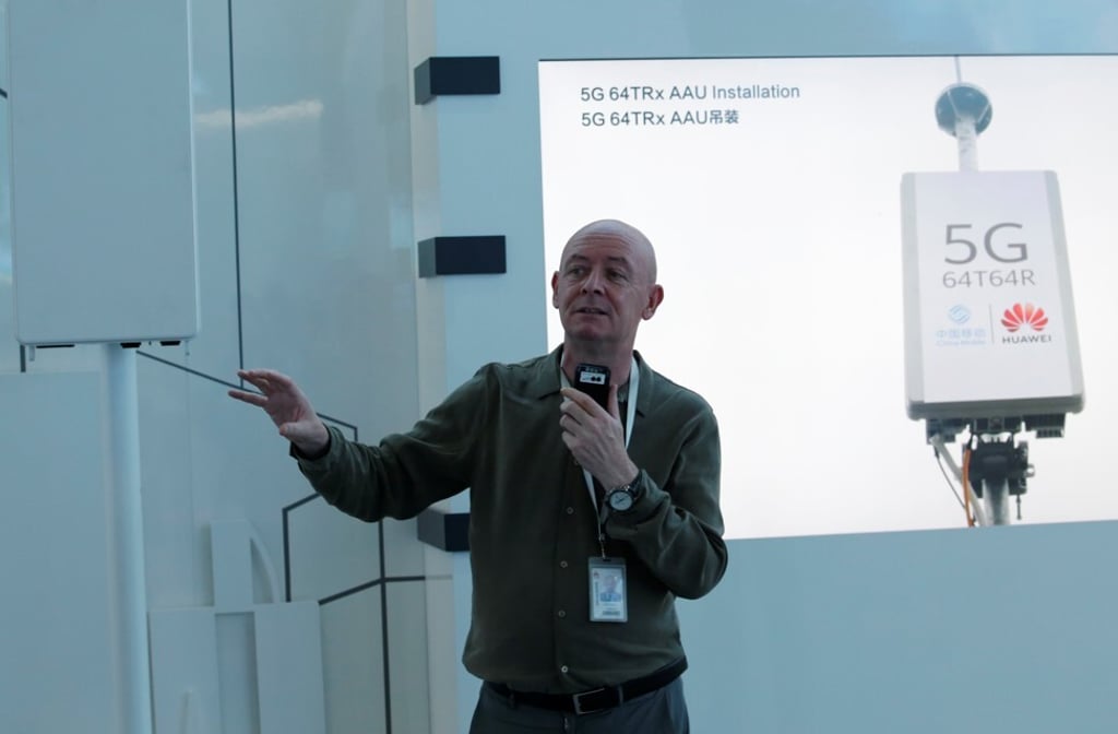 Joe Kelly discusses the features of Huawei Technologies’ 5G base station in a show room at the company’s headquarters in Shenzhen on May 29, 2019. Photo: Reuters
