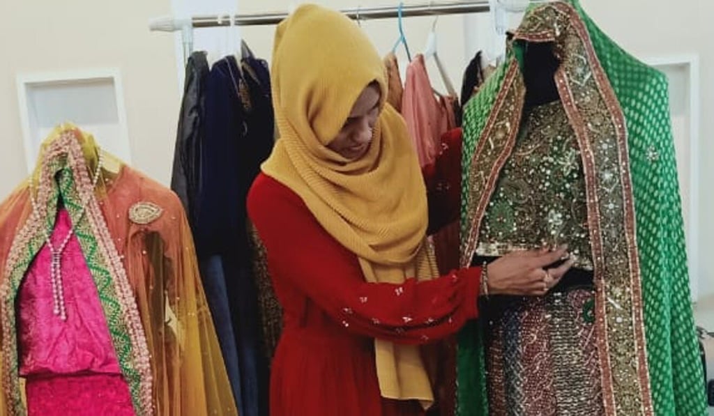 Sabitha shows one of the outfits available in her bridal store. Photo: Amrit Dhillon Sabitha shows one of the outfits available in her bridal store. Photo: Amrit Dhillon