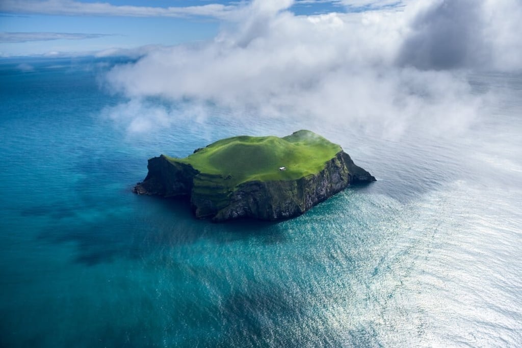 If you still want to get away from it all after months of Covid-19-induced isolation, there is no shortage of small islands to explore, such as this one in Iceland (sorry, no palm trees or deserted beach). Photo: Shutterstock