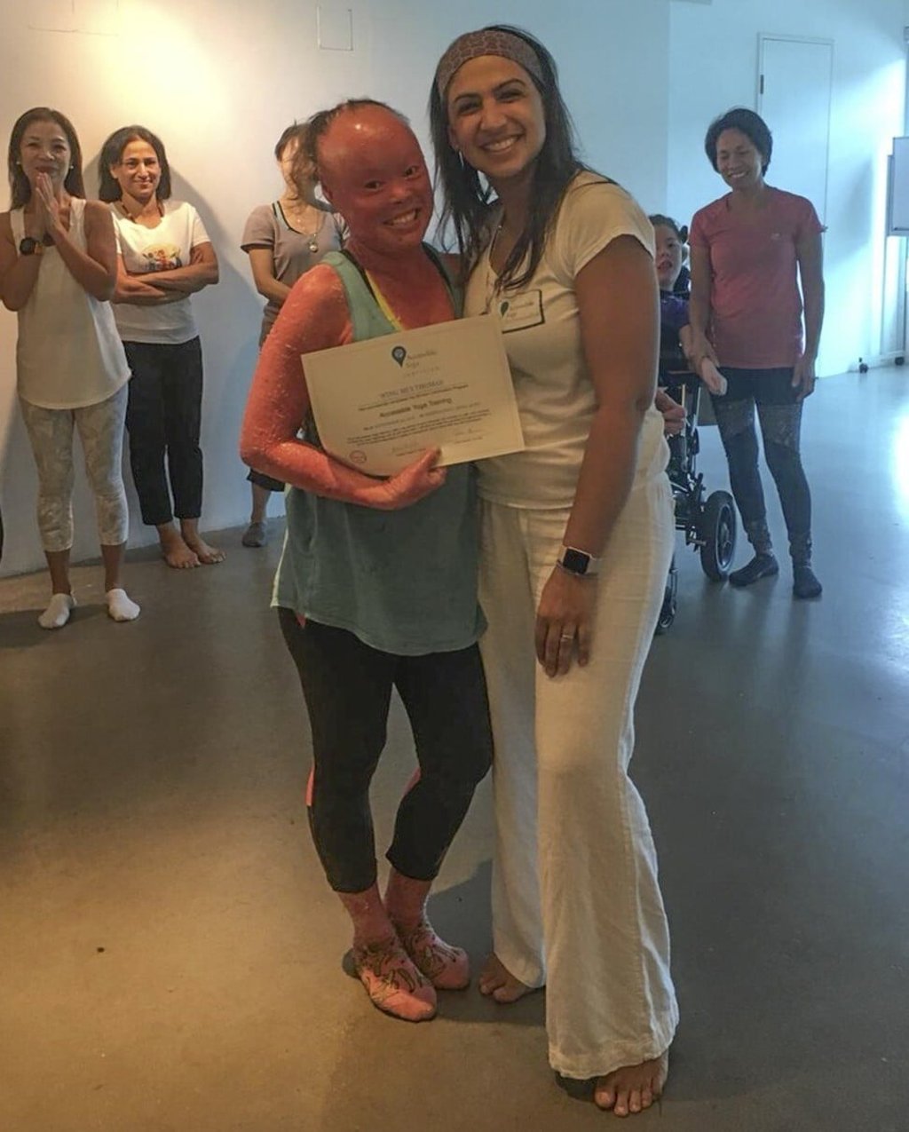 Thomas receives a certificate to teach yoga to people with special needs from Hersha Chellaram, a co-founder of the Yama Foundation. Photo: Yama Foundation Thomas receives a certificate to teach yoga to people with special needs from Hersha Chellaram, a co-founder of the Yama Foundation. Photo: Yama Foundation