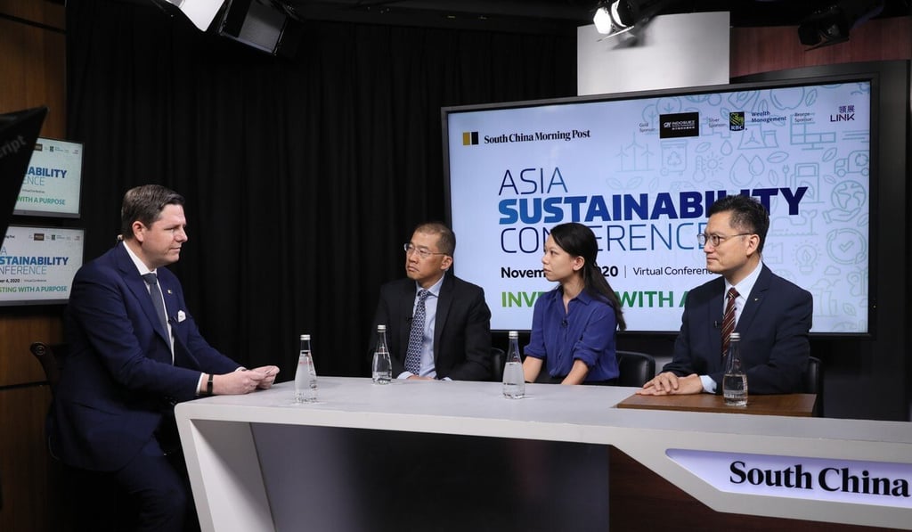 The SCMP’s Chad Bray, left, discusses green bonds with Kok Siong Ng, chief financial officer of Link Asset Management, Ellen Lam, senior adviser for environmental finance at WWF-Hong Kong, and Issac Yeung, general manager of Hong Kong and China Gas Company, at the Asia Sustainability Conference on Wednesday. Photo: SCMP