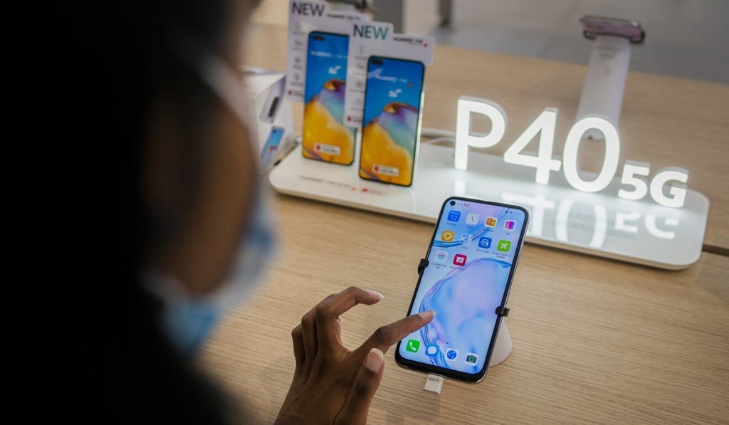 A customer tests a Huawei P40 5G-ready smartphone on display inside a Huawei Technologies store in Pretoria, South Africa. Photo: Bloomberg