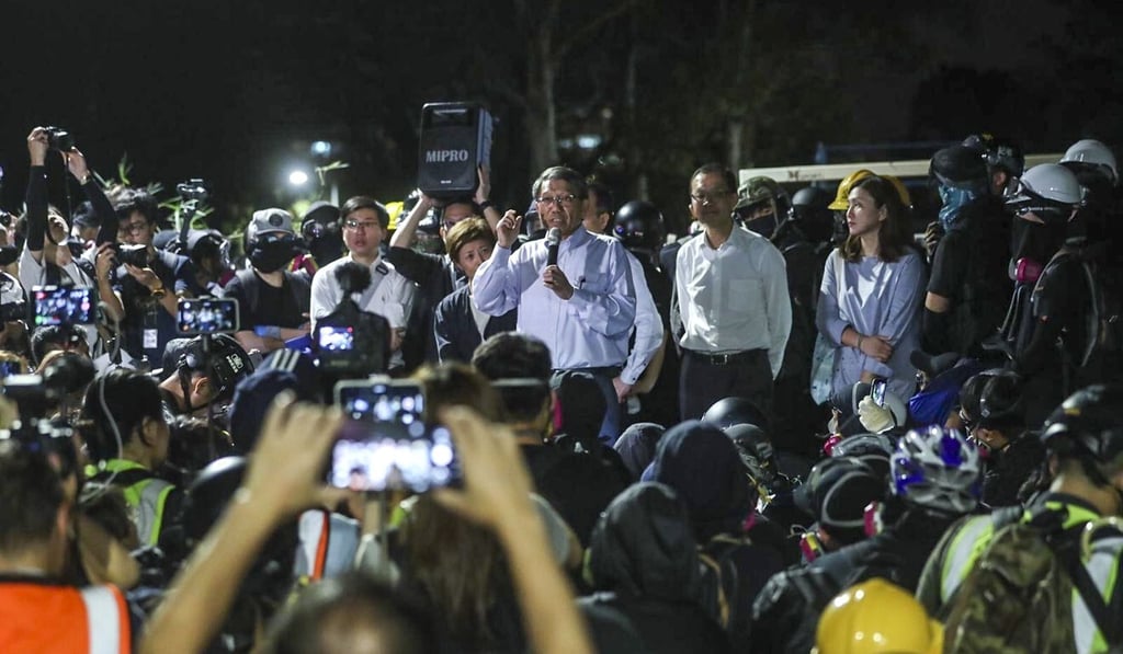 Rocky Tuan (centre) meets protesters on campus after clashes with police. Photo: Sam Tsang Rocky Tuan (centre) meets protesters on campus after clashes with police. Photo: Sam Tsang