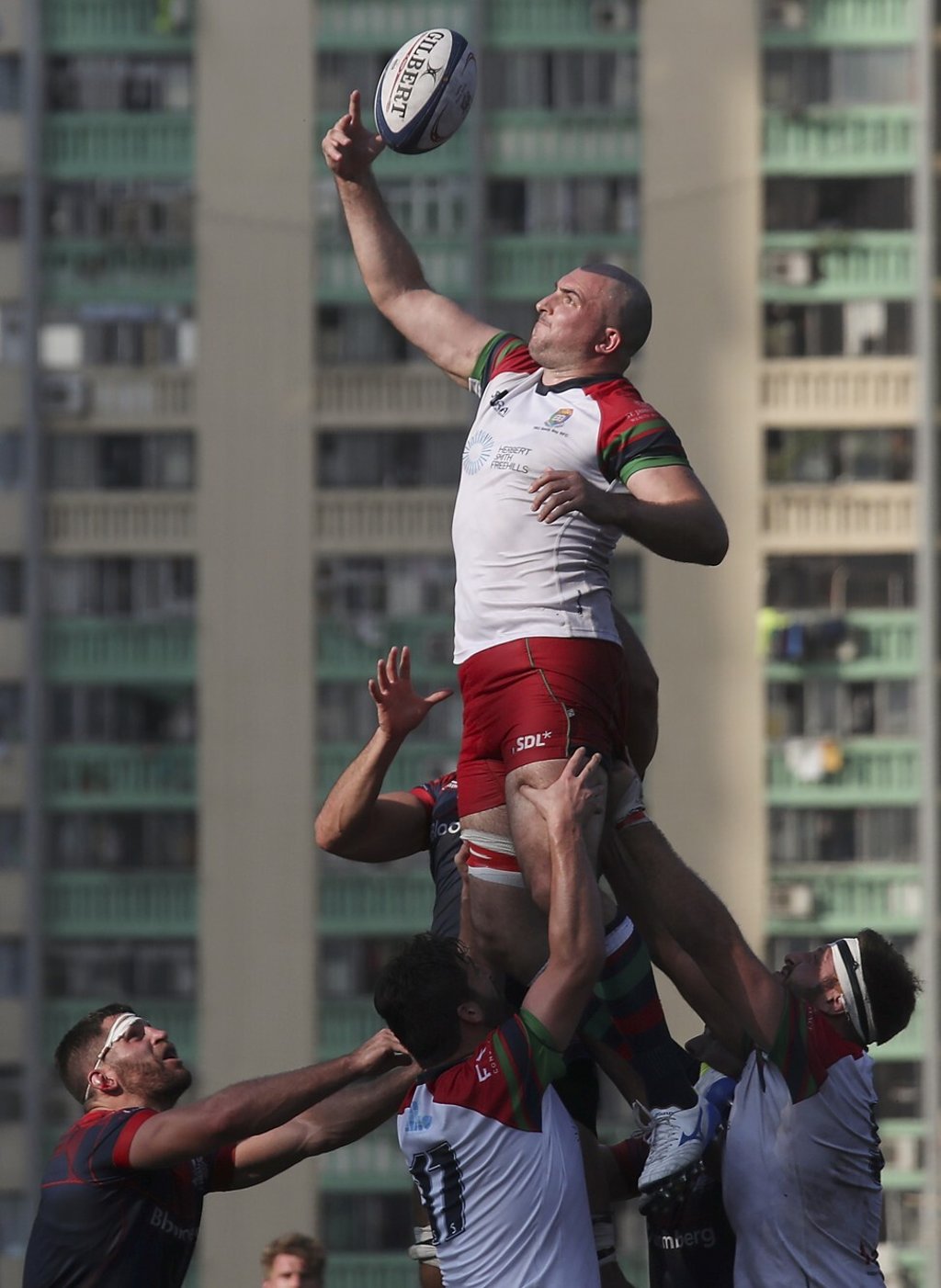 HKU Sandy Bay's Benjamin Davey wins a line-out during their win against HK Scottish at King’s Park Sports Ground. Photo: SCMP/Xiaomei Chen