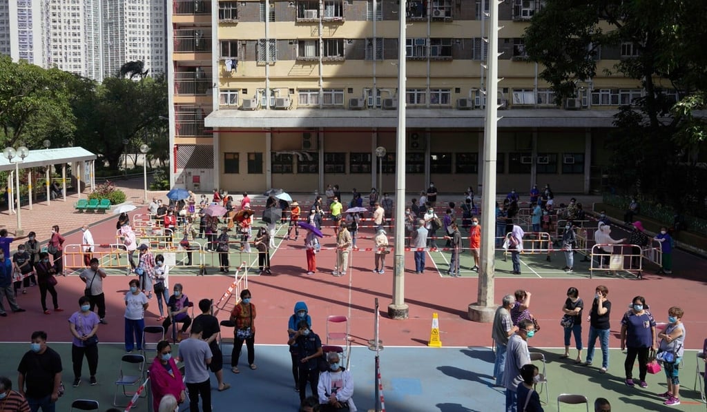 Tai Po residents line up outside a temporary Covid-19 testing centre at Kwong Fuk Estate. Photo: Sam Tsang