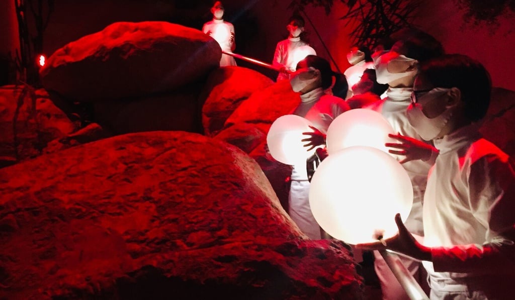 Members of Hong Kong Children's Choir sing lyrics they wrote themselves on their concerns about pollution and the health of the planet in the after-dark experiential production, Aria.