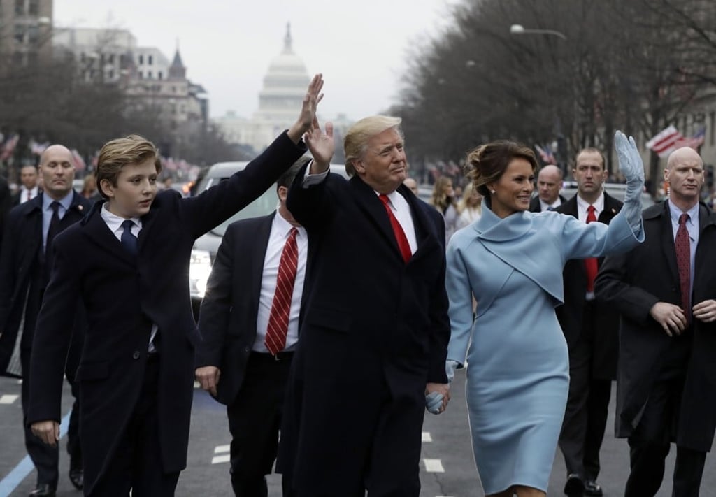 President Donald Trump, first lady Melania and their son Barron during the inauguration parade on Pennsylvania Avenue in Washington. Photo: AP