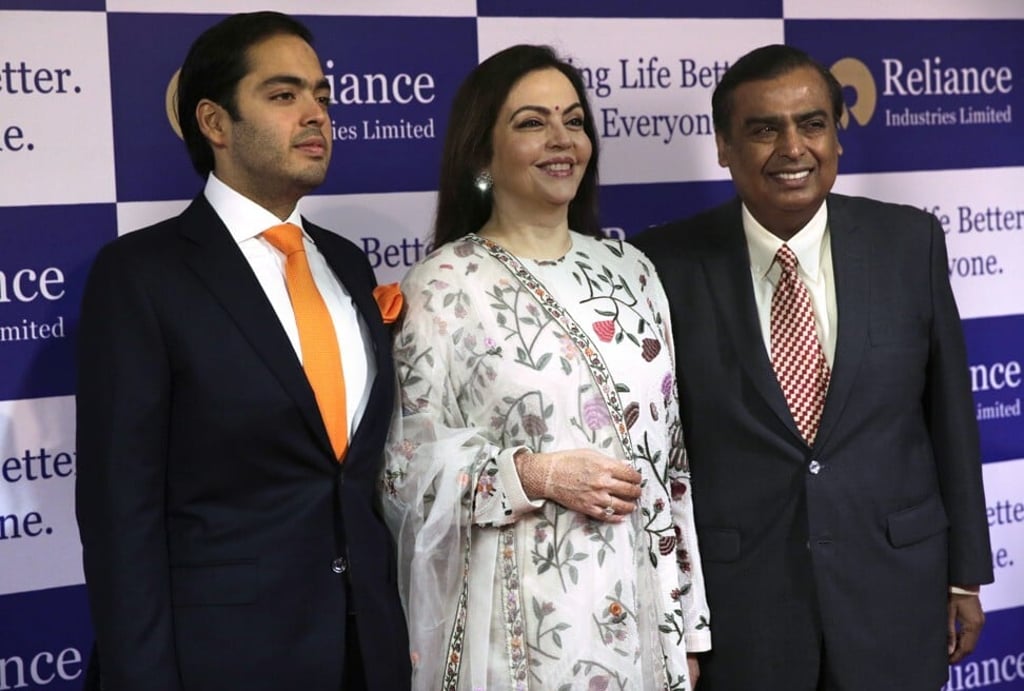 Mukesh Ambani, right, with his wife Nita and son Anant at Reliance Industries’ annual general meeting in Mumbai, India, in 2018. Photo: AP Mukesh Ambani, right, with his wife Nita and son Anant at Reliance Industries’ annual general meeting in Mumbai, India, in 2018. Photo: AP