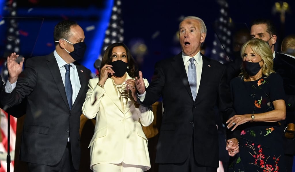 US President-elect Joe Biden and Vice President-elect Kamala Harris, their spouses Jill Biden and Douglas Emhoff, react as confetti falls in Wilmington, Delaware, after they were declared the winners of the US presidential election on Saturday. Photo: AFP
