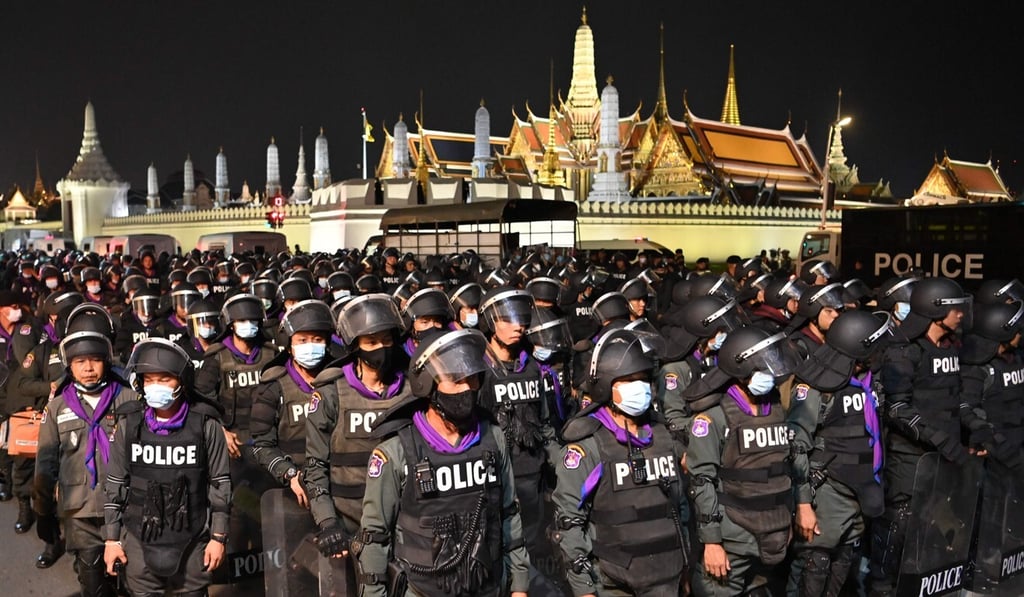 Riot police stand guard in front of the Grand Palace in Bangkok. Photo: AFP