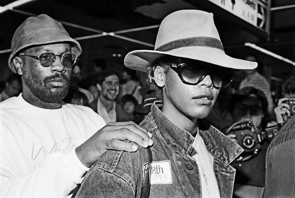 The singer is ushered through a frenzied crowd of fans at Kai Tak Airport on November 14, 1988. Photo: SCMP