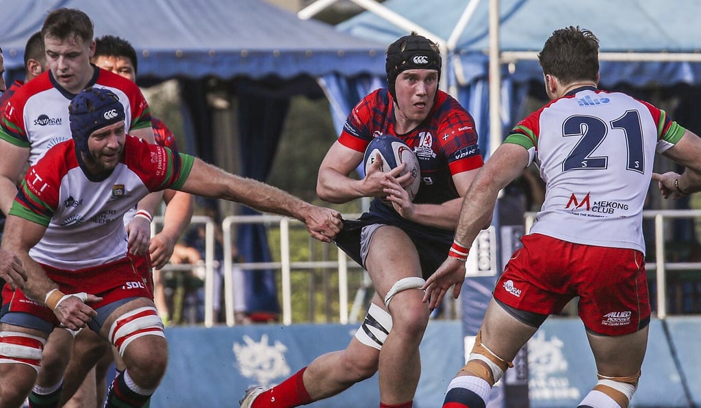 HK Scottish’s Charlie Morgan runs at the HKU Sandy Bay defence in round one. Photo: SCMP/Xiaomei Chen HK Scottish’s Charlie Morgan runs at the HKU Sandy Bay defence in round one. Photo: SCMP/Xiaomei Chen