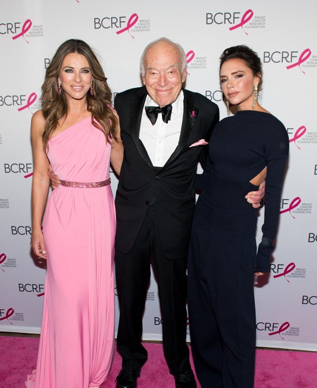 Elizabeth Hurley, Leonard Lauder and Victoria Beckham attend the 2017 Breast Cancer Research Foundation Hot Pink Party in New York in 2017. Lauder is a donor to the foundation. Photo: Noam Galai/WireImage Elizabeth Hurley, Leonard Lauder and Victoria Beckham attend the 2017 Breast Cancer Research Foundation Hot Pink Party in New York in 2017. Lauder is a donor to the foundation. Photo: Noam Galai/WireImage