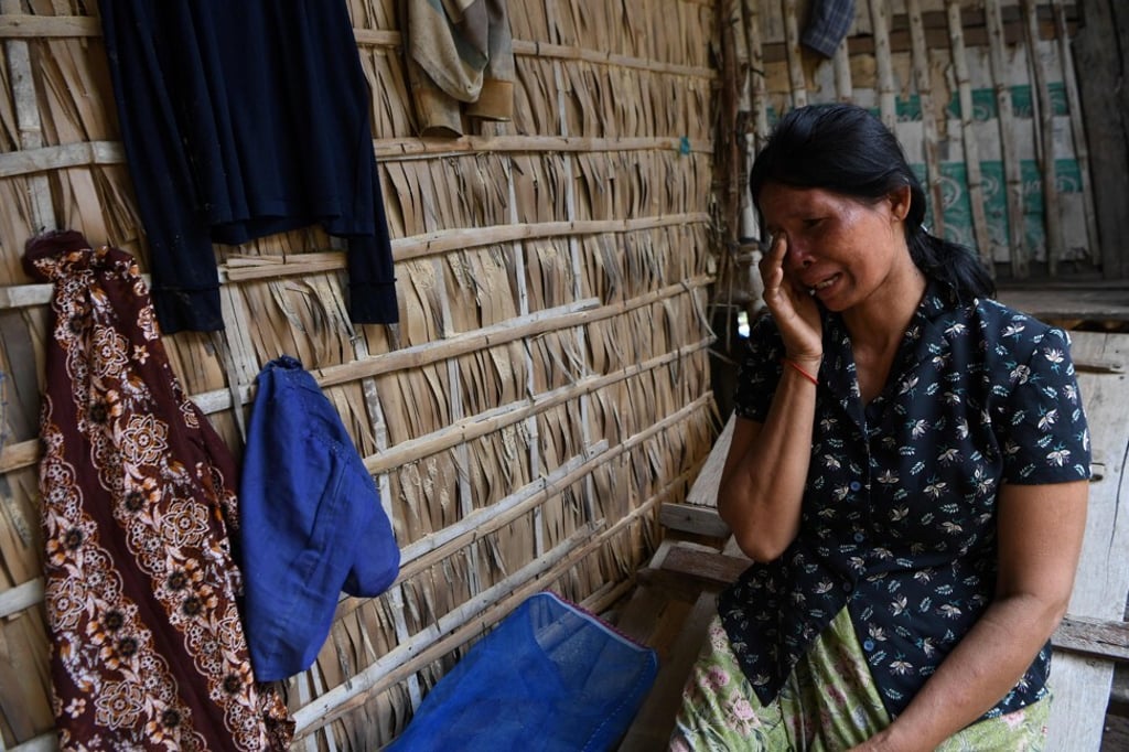 Roeurm Reth, 50, fears she will have to sell her farm if she cannot repay her growing debt. Photo: AFP
