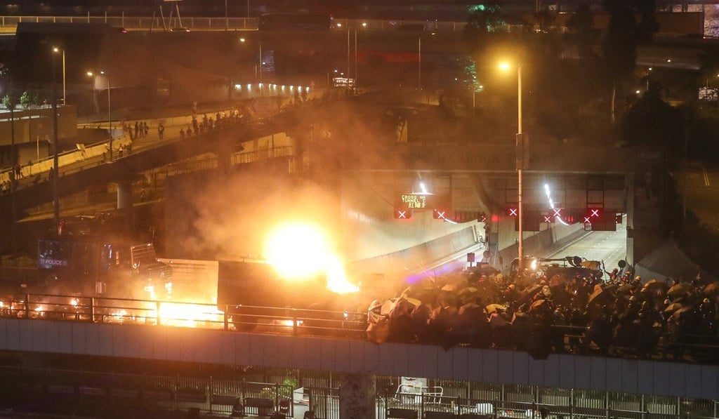 Petrol bombs burst on a police armoured vehicle on the Cheong Wan Road flyover during clashes at Polytechnic University last year. Photo: Sam Tsang Petrol bombs burst on a police armoured vehicle on the Cheong Wan Road flyover during clashes at Polytechnic University last year. Photo: Sam Tsang