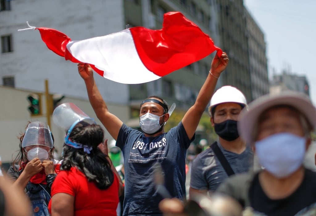 People celebrate outside the Congress in Lima after Manuel Merino’s resignation on November 15, 2020. Photo: AFP
