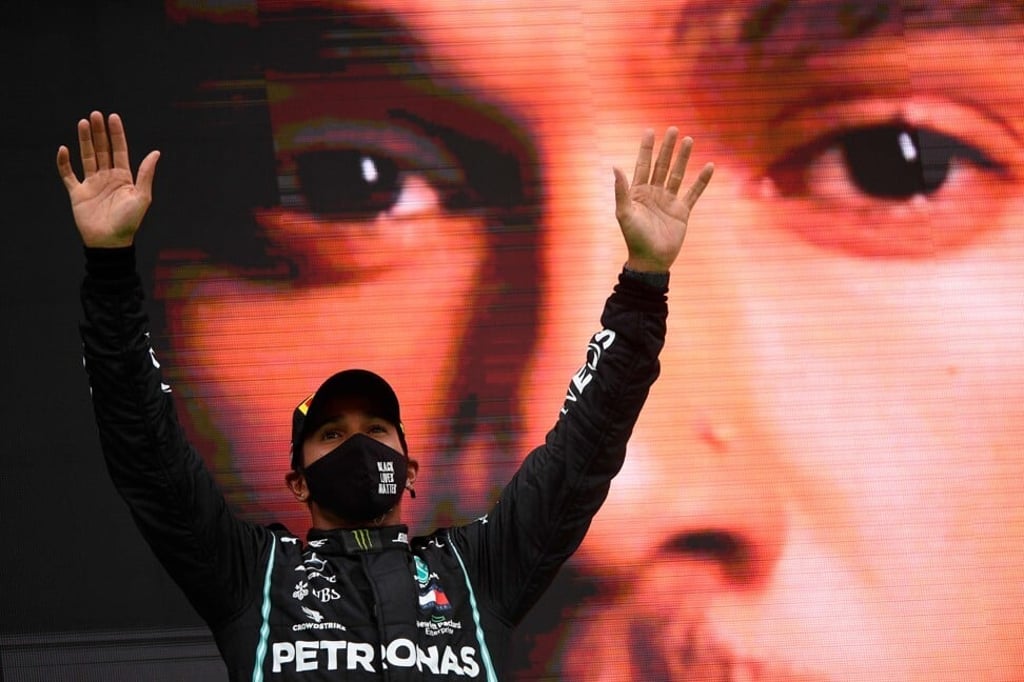 Mercedes' British driver Lewis Hamilton celebrates after winning the Portuguese Formula One Grand Prix on October 25, 2020 in Portimao. Photo: AFP Mercedes' British driver Lewis Hamilton celebrates after winning the Portuguese Formula One Grand Prix on October 25, 2020 in Portimao. Photo: AFP