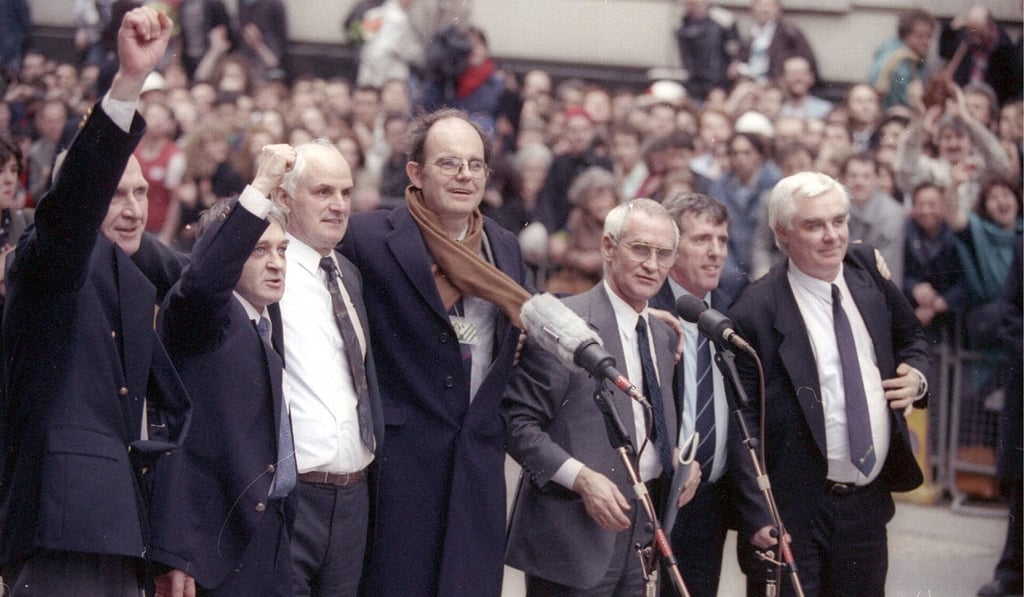 Acquitted members of the Birmingham Six, sent to prison in 1975 for the IRA’s bombing of two pubs, gather with their MP after they walk from court as free men. Photo: Reuters