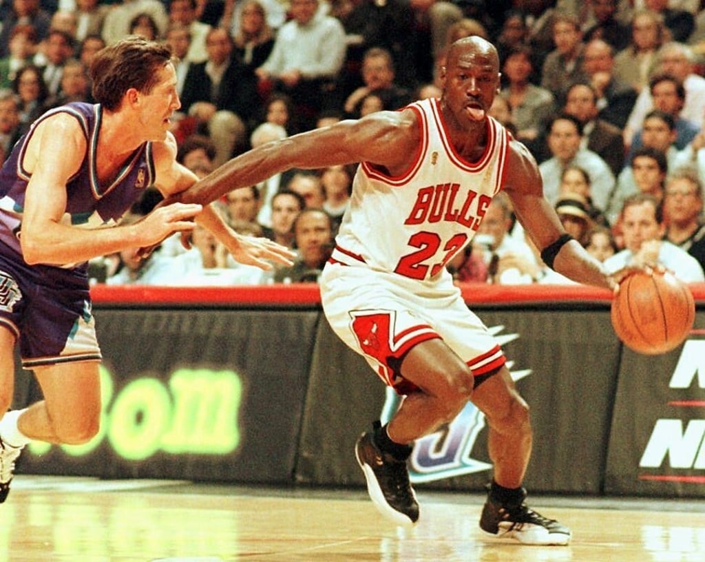 Chicago Bulls player Michael Jordan goes past Jeff Hornacek of the Utah Jazz during game two of the NBA Finals at the United Centre in Chicago, in the US state of Illinois, on June 4, 1997. Photo: AFP