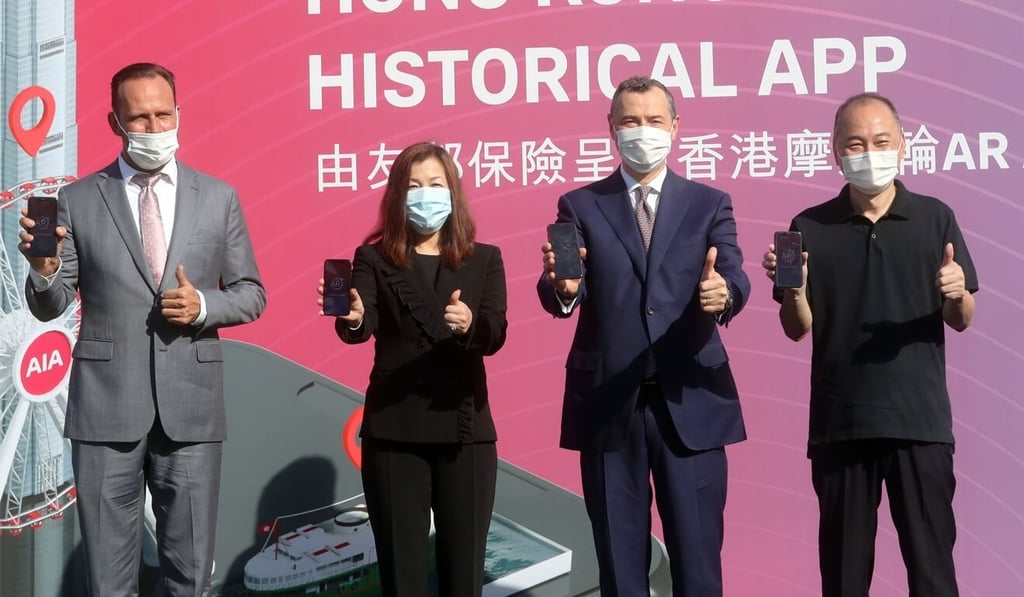 (From left) Alex Gibbs, commercial director at Hong Kong Observation Wheel; Bonnie Tse, general manager, strategy and wealth management of AIA Hong Kong & Macau; Stuart Spencer, group chief marketing officer, AIA Group Limited; and historian Ko Tim-keung at the launch of the Hong Kong Observation Wheel Historical App at AIA Vitality Park in Central on Thursday. Photo: Edmond So