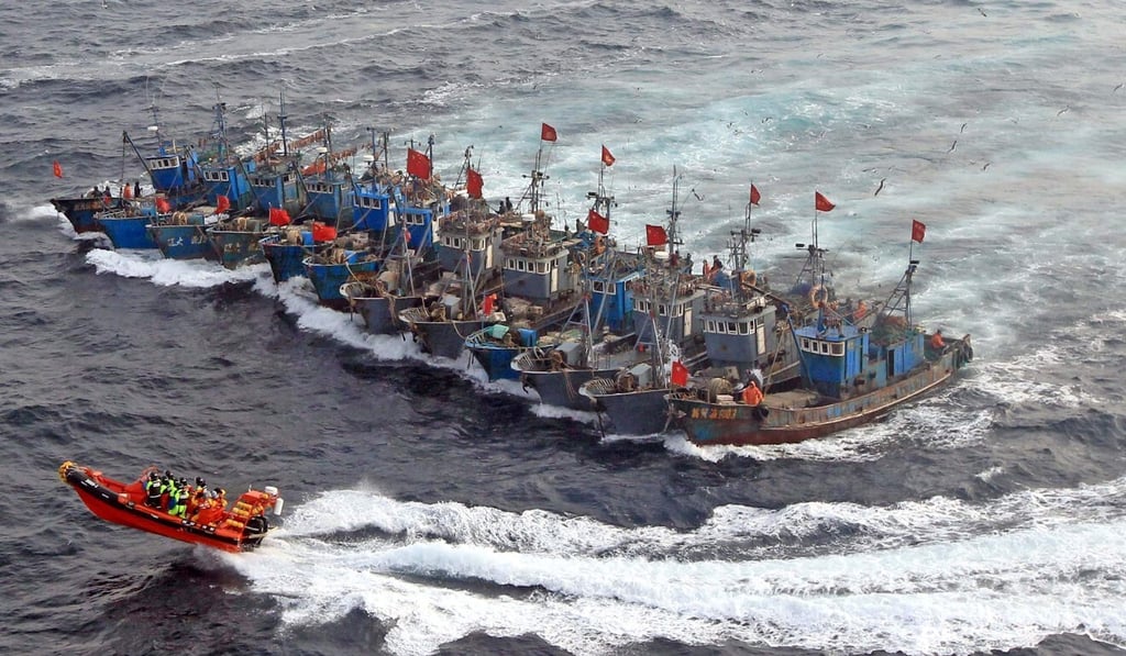 South Korean coast guard ships attempt to stop 12 Chinese fishing boats bound together with ropes illegally fishing in the Yellow Sea. Photo: AFP