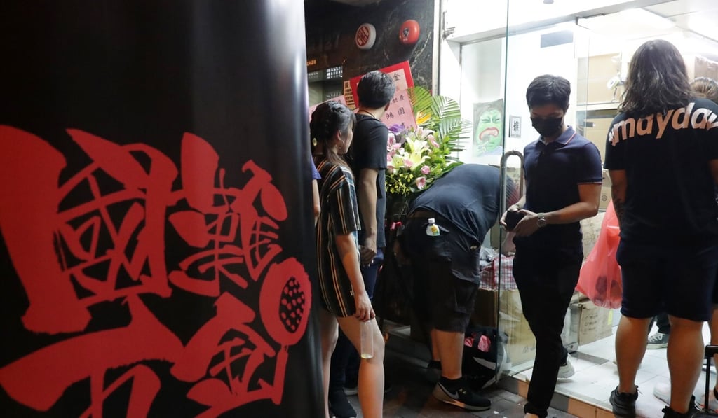 Customers outside the National Disaster Hardware shop last year. Photo: Edmond So