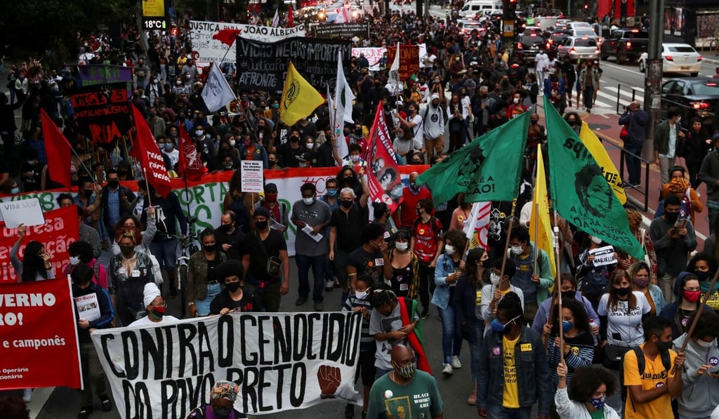 Demonstrators march in Sao Paulo on National Black Consciousness Day and in protest against the death of Joao Alberto Silveira Freitas. Photo: Reuters Demonstrators march in Sao Paulo on National Black Consciousness Day and in protest against the death of Joao Alberto Silveira Freitas. Photo: Reuters