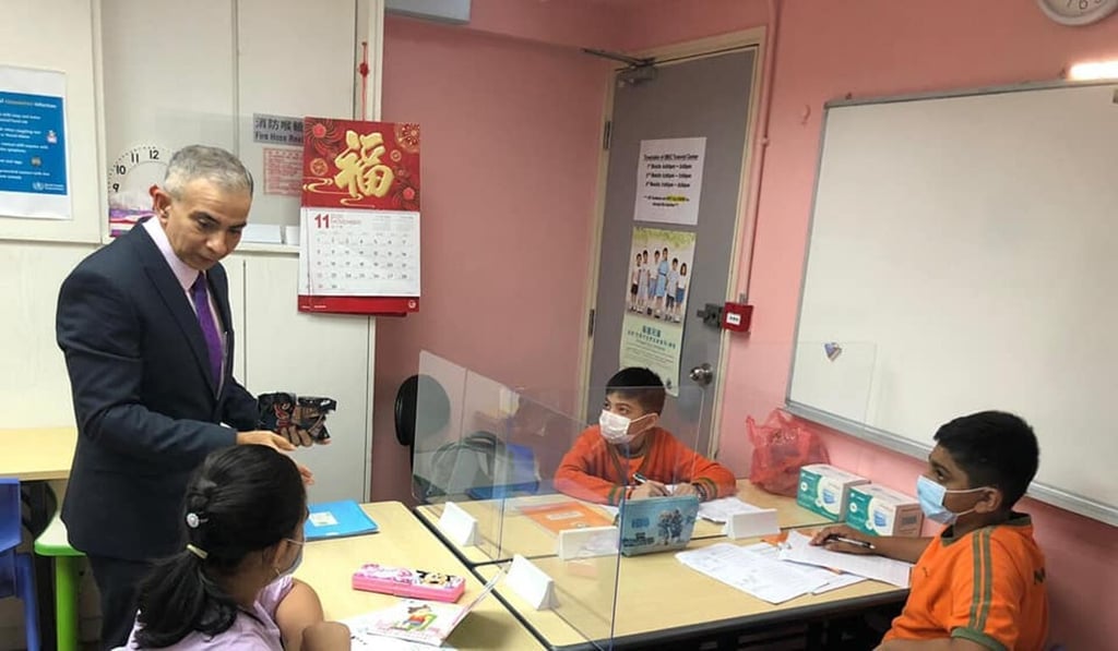 Manoj Dhar with students at one of the Integrated Brilliant Education Ltd centres. Photo: IBEL