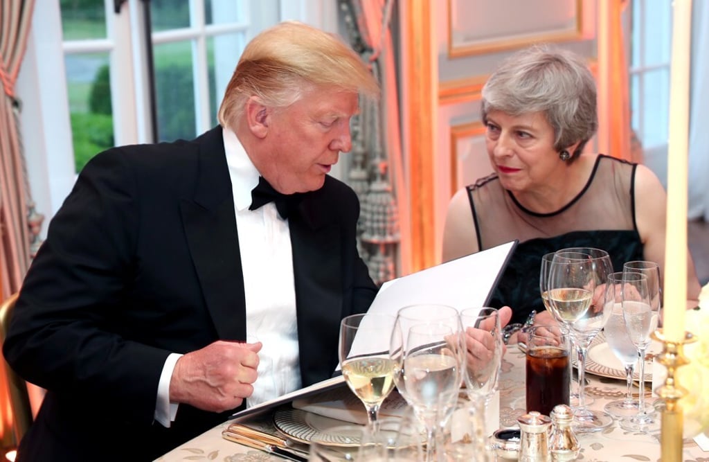 Donald Trump and British Prime Minister Theresa May speak at a classier dinner setting that the US President may have preferred. Photo: Reuters