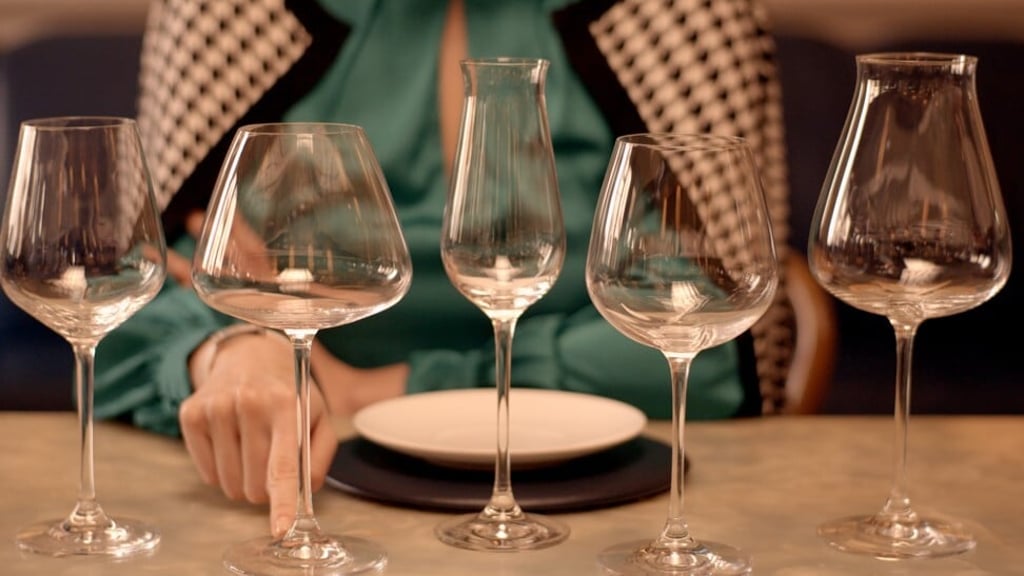 No matter the shape or size of the wine glass, it should always be held by the stem or base.