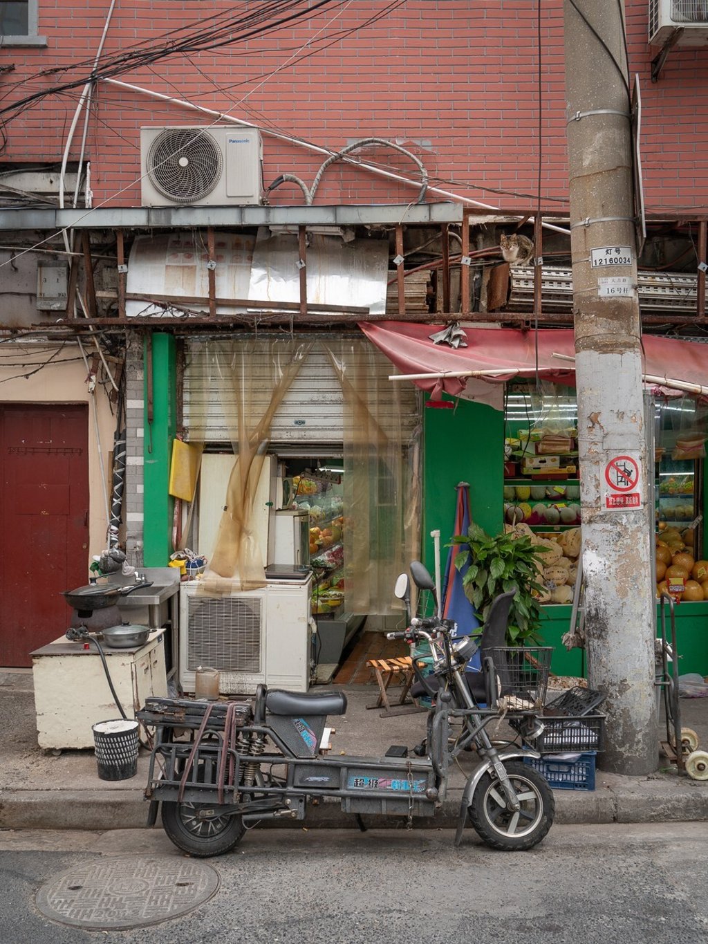 Each photograph from the book requires a long look to find the feline in a shop or market place. Can you spot this one? Photo: Marcel Heijnen Each photograph from the book requires a long look to find the feline in a shop or market place. Can you spot this one? Photo: Marcel Heijnen