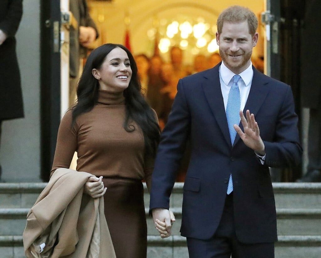Britain's Prince Harry and Meghan, Duchess of Sussex leaving Canada House in London. Photo: AP Britain's Prince Harry and Meghan, Duchess of Sussex leaving Canada House in London. Photo: AP