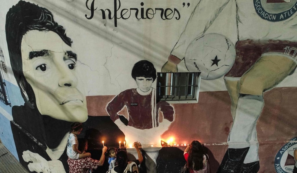 Fans of Argentinian legend Diego Maradona gather outside Argentinos Junior’s Diego Armando Maradona Stadium to mourn his death. Photo: AFP Fans of Argentinian legend Diego Maradona gather outside Argentinos Junior’s Diego Armando Maradona Stadium to mourn his death. Photo: AFP