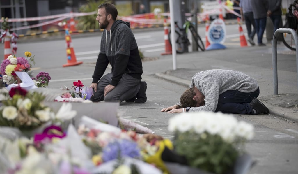 Mourners pray near the Linwood mosque in Christchurch on March 19, 2019. Photo: AP Mourners pray near the Linwood mosque in Christchurch on March 19, 2019. Photo: AP