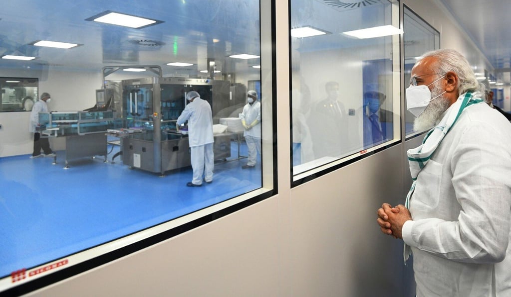 Indian Prime Minister Narendra Modi visits the Serum Institute of India to review progress on the development of a Covid-19 vaccine on Saturday. Photo: EPA