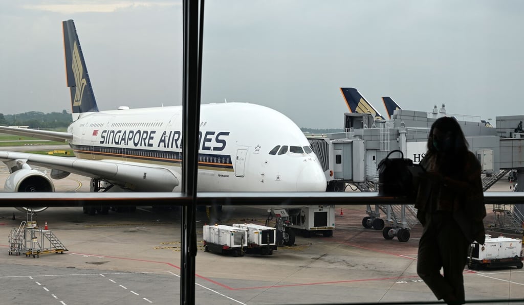 A Singapore Airlines Airbus A380 plane is parked on the tarmac at Changi International Airport in Singapore on October 24. A Hong Kong-Singapore travel bubble was postponed a day before its launch. Photo: AFP A Singapore Airlines Airbus A380 plane is parked on the tarmac at Changi International Airport in Singapore on October 24. A Hong Kong-Singapore travel bubble was postponed a day before its launch. Photo: AFP