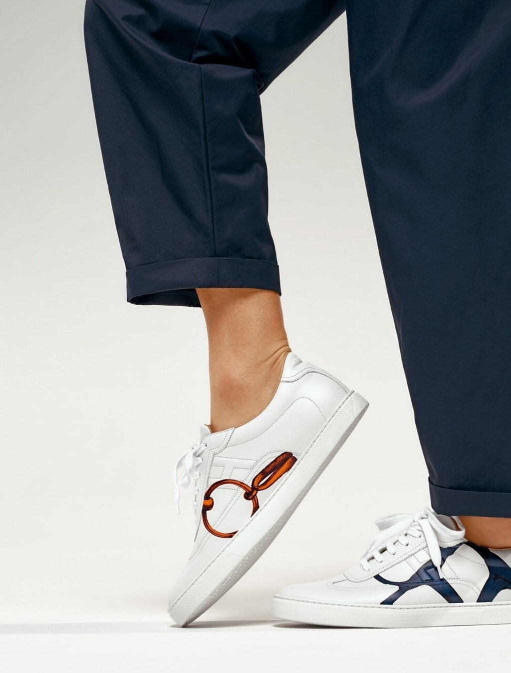 Classic white trainers get a lift with bold signature patterns. Photo: Hermès Classic white trainers get a lift with bold signature patterns. Photo: Hermès
