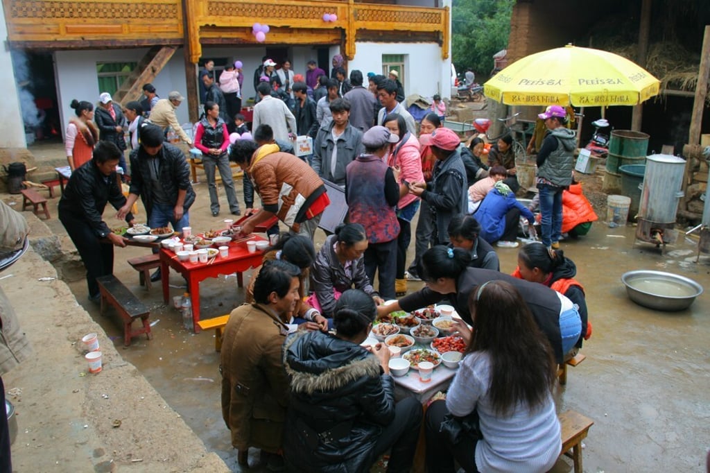 A traditional wedding ceremony and wedding feast takes place in Yunnan, Lijiang, China. Photo: Shutterstock