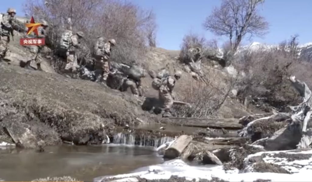 The CCTV report showed soldiers crossing a river and trekking through difficult terrain. Photo: Weibo