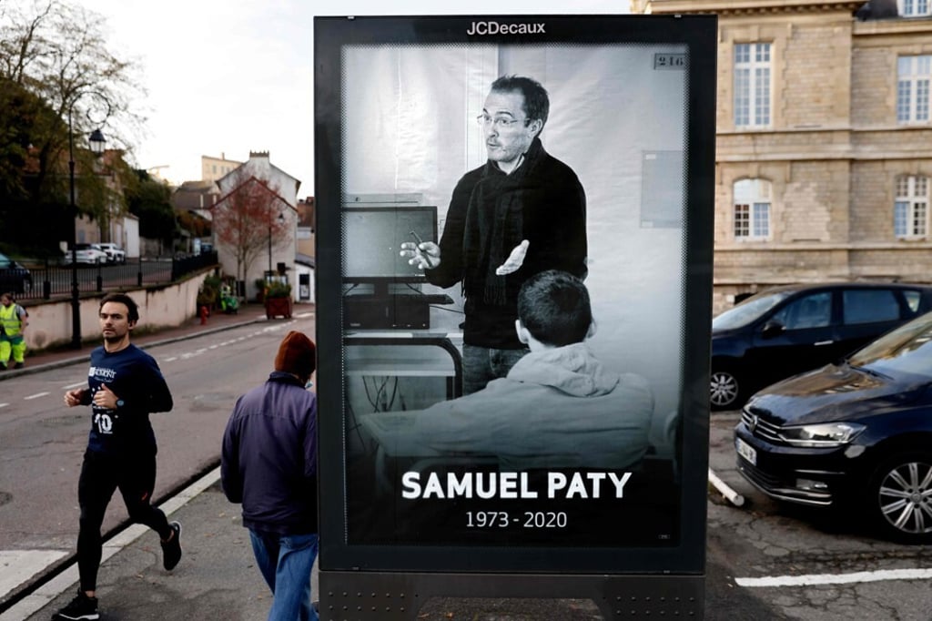 A poster of teacher Samuel Paty, who was decapitated by a suspected Islamist radical on October 16, in Conflans-Sainte-Honorine, 30km northwest of Paris. Photo: AFP