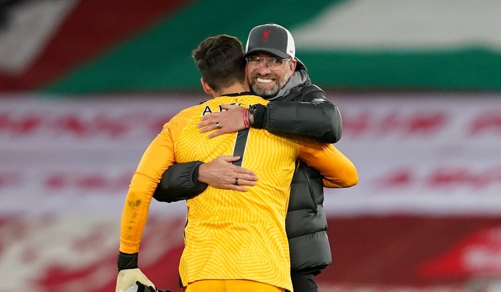 Liverpool manager Jurgen Klopp hugs goalkeeper Alisson Becker after the 3-0 victory over Leicester City at Anfield in November. Photo: AFP