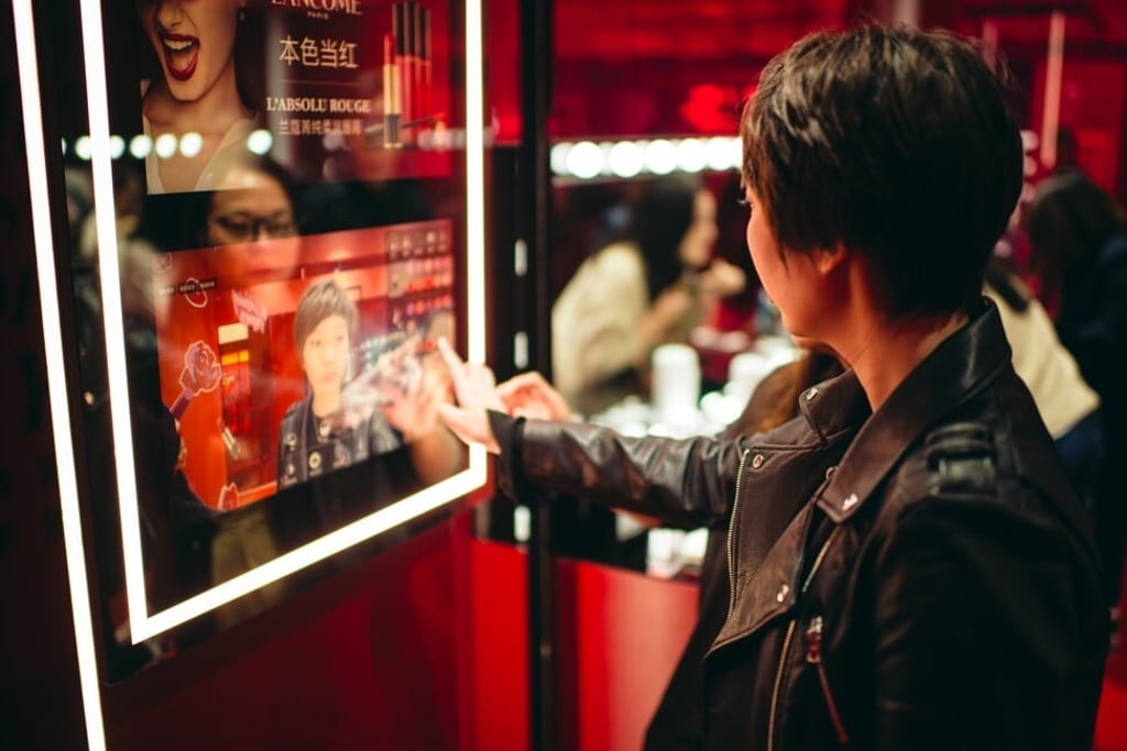 A guest trying out virtual make-up supported by Tmall’s Luxury Pavilion. Photo: Bruce Qian