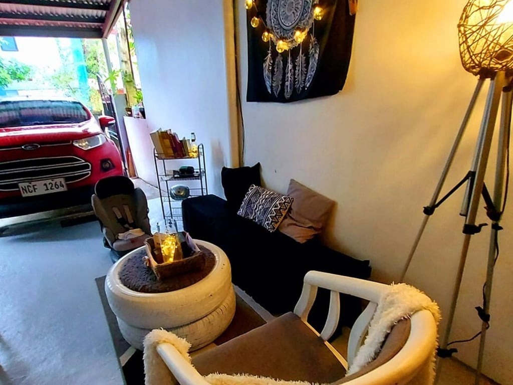 Camille Peredo transformed a part of her family home’s garage into an outdoor lounge using upcycled furniture and DIY decorations. Photo: Elyssa Lopez Camille Peredo transformed a part of her family home’s garage into an outdoor lounge using upcycled furniture and DIY decorations. Photo: Elyssa Lopez