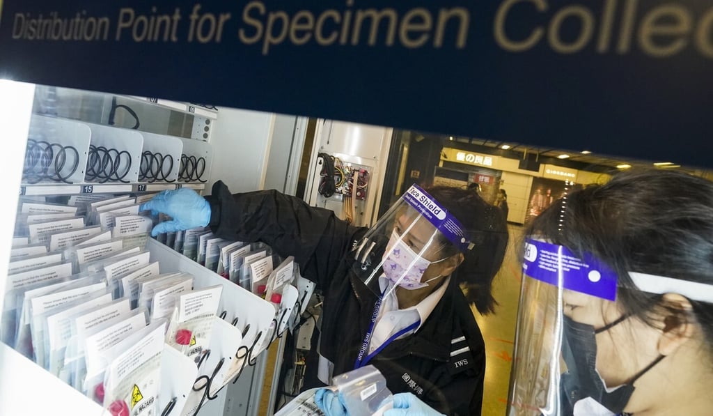 A vending machine is stocked with free testing kits at the MTR station in Tai Wai. Photo: Felix Wong