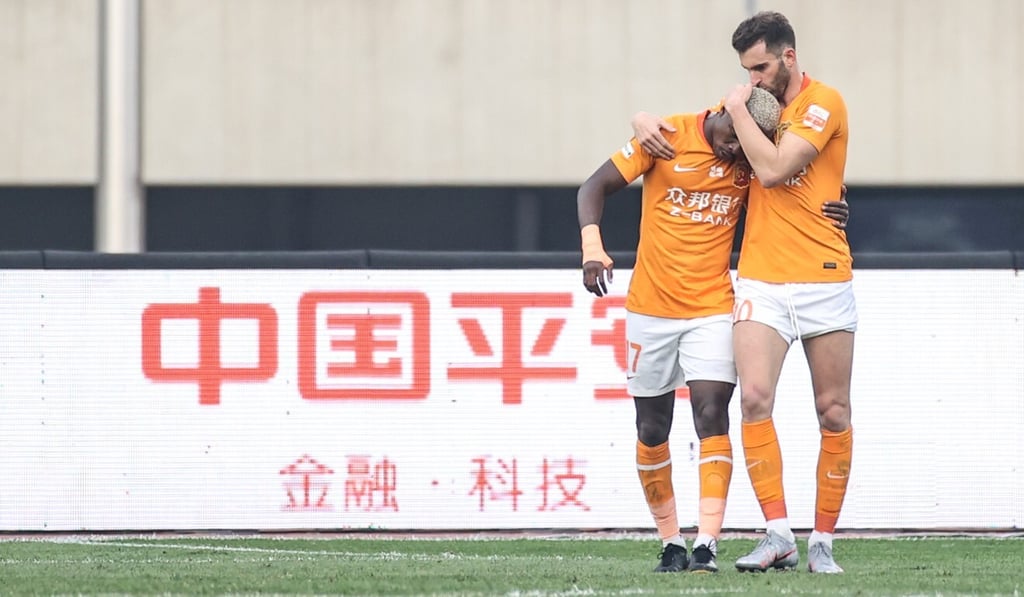 Jean Evrard Kouass celebrates with Leo Baptistao after scoring against Shijiazhuang Ever Bright. Photo: Xinhua Jean Evrard Kouass celebrates with Leo Baptistao after scoring against Shijiazhuang Ever Bright. Photo: Xinhua