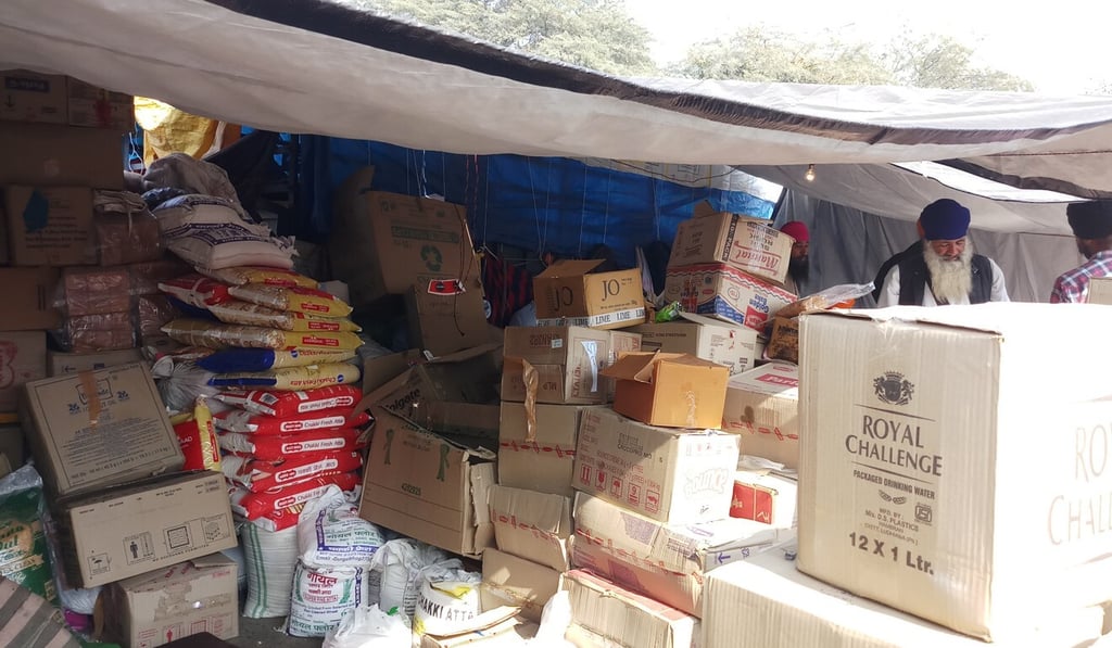 Boxes of food are seen in tents at the Singhi camp site in New Delhi, India. Photo: Amrit Dhillon