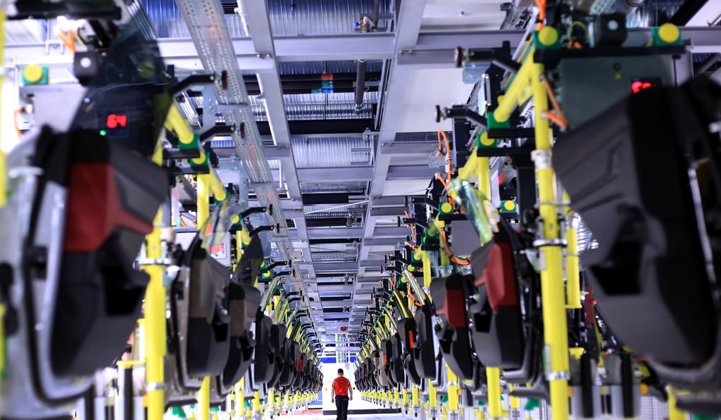 An employee walks between racks of doors at the Porsche AG factory in Stuttgart, Germany. While the German economy is seen as extremely stable today, it witnessed a breakdown in order less than a century ago. Photo: Bloomberg An employee walks between racks of doors at the Porsche AG factory in Stuttgart, Germany. While the German economy is seen as extremely stable today, it witnessed a breakdown in order less than a century ago. Photo: Bloomberg