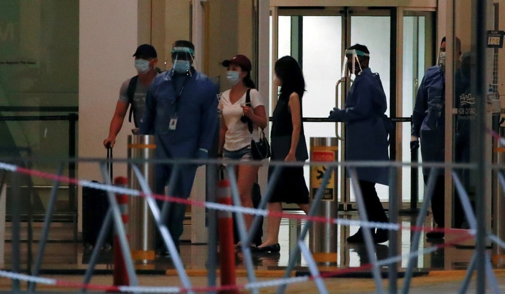 Passengers leave Marina Bay Cruise Centre after disembarking from the Quantum of the Seas cruise ship in Singapore. Photo: Reuters