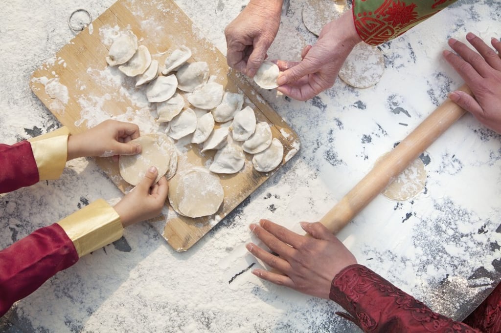 The annual dumpling-making ritual encourages interaction between different family generations. Photo: Getty Images The annual dumpling-making ritual encourages interaction between different family generations. Photo: Getty Images