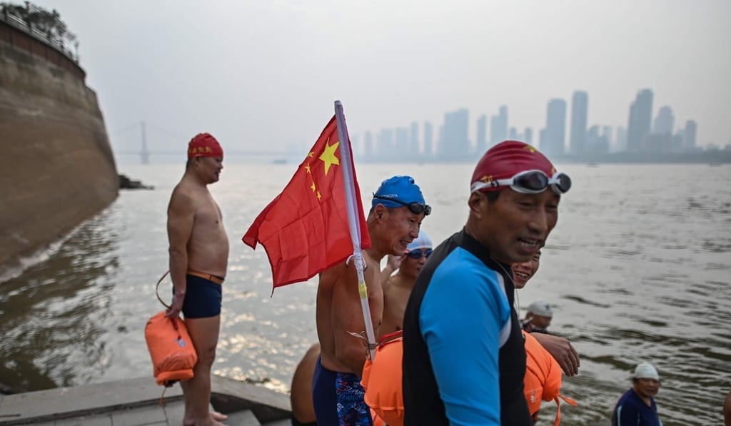A group prepares to swim in the Yangtze River at Wuhan. Photo: AFP A group prepares to swim in the Yangtze River at Wuhan. Photo: AFP